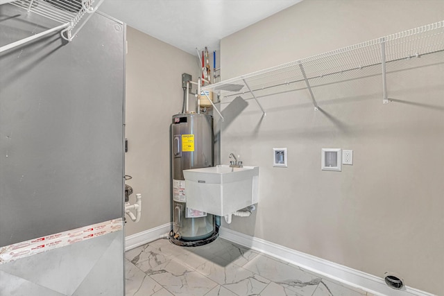 utilities featuring a sink and electric water heater