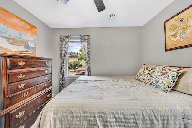 bedroom with visible vents and ceiling fan