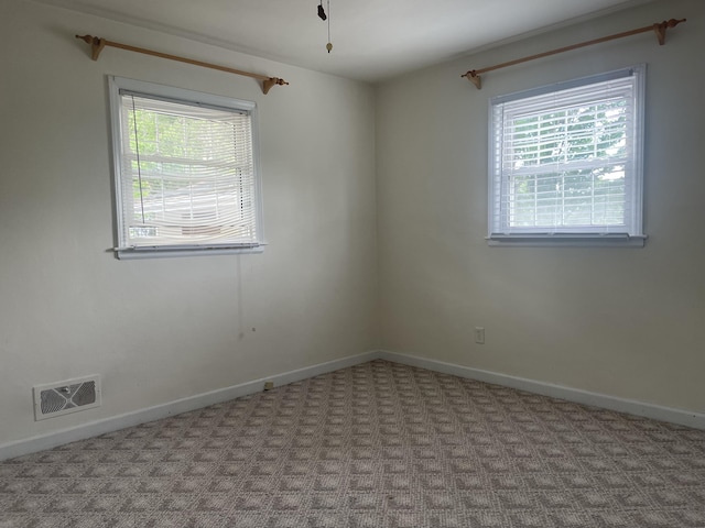 1508 Jefferson Ave, Clifton Forge, VA 24422 - carpeted empty room featuring plenty of natural light and baseboards