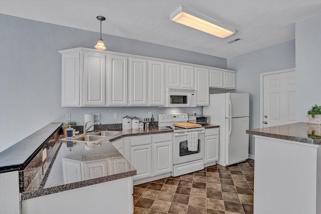 kitchen featuring white cabinets, a sink, white appliances, a peninsula, and visible vents
