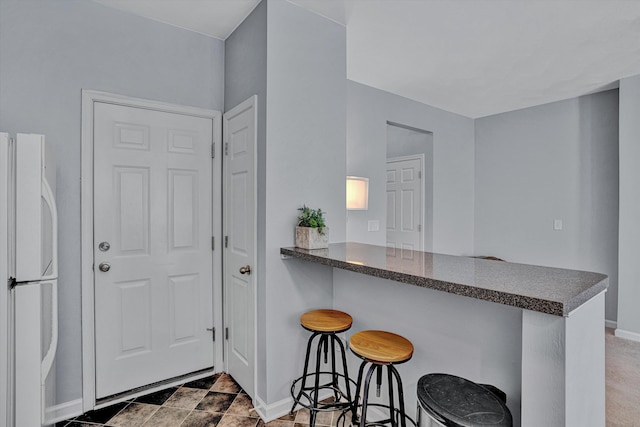 interior space featuring baseboards