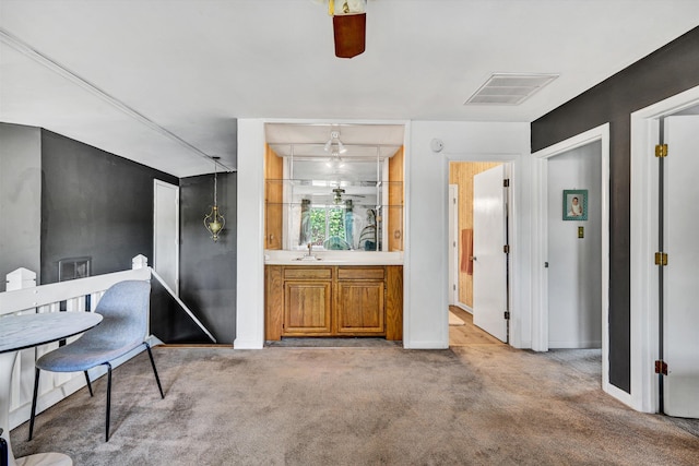 117 Windward Dr SW, Roanoke, VA 24018 - kitchen featuring a sink, dark stone countertops, backsplash, and brown cabinets