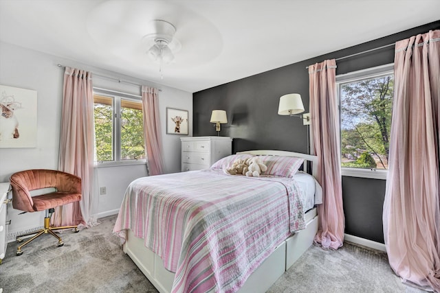 bedroom featuring carpet floors, baseboards, and a ceiling fan