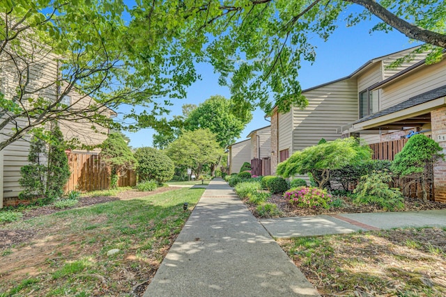view of property's community featuring fence