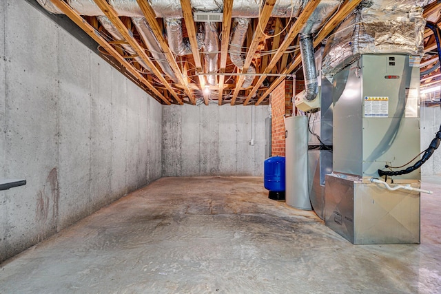 5531 Bethlehem Rd, Boones Mill, VA 24065 - unfinished basement with a water pressure tank, water heater, and heating unit
