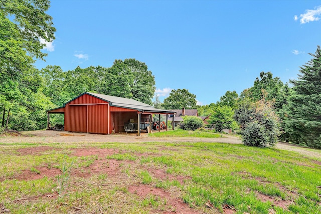 5531 Bethlehem Rd, Boones Mill, VA 24065 - view of yard featuring an outbuilding, an outdoor structure, and driveway