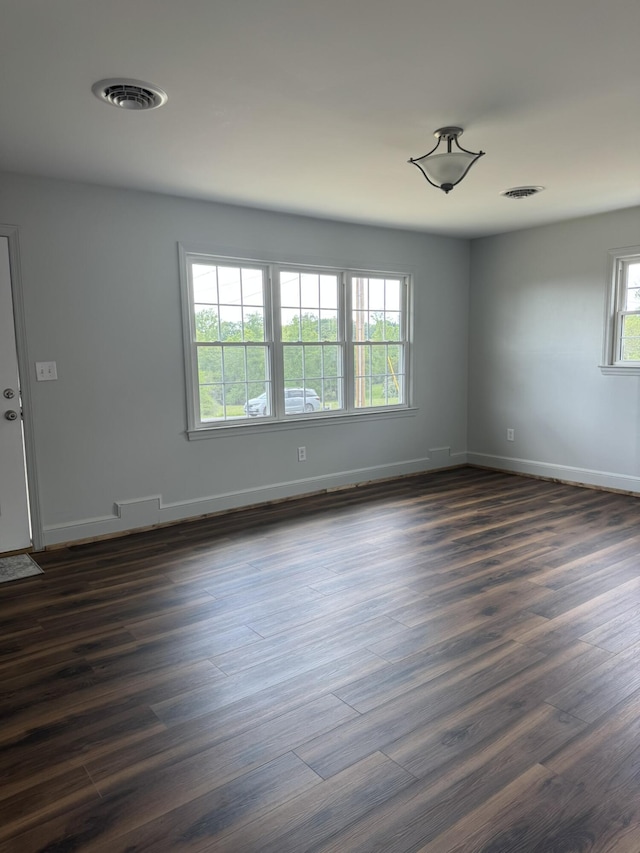 3779 Old Franklin Tpke, Glade Hill, VA 24092 - spare room featuring baseboards, dark wood-style flooring, and visible vents