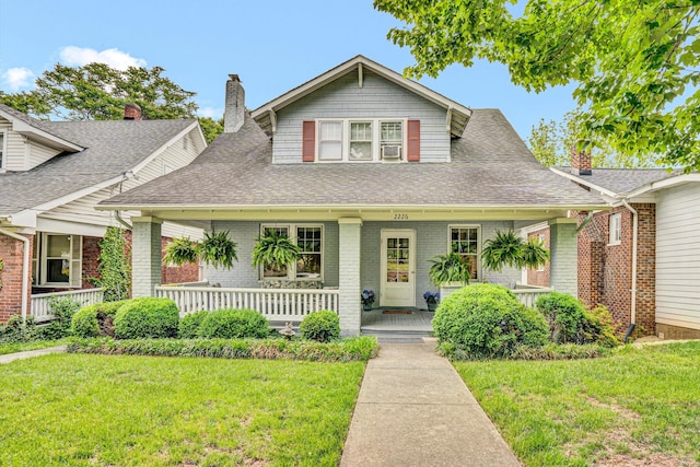 2226 Wycliffe Ave SW, Roanoke, VA 24014 - view of front of home featuring covered porch, a front yard, and roof with shingles