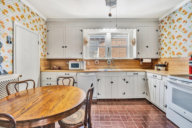 2226 Wycliffe Ave SW, Roanoke, VA 24014 - kitchen with wallpapered walls, white appliances, a sink, brick patterned flooring, and crown molding