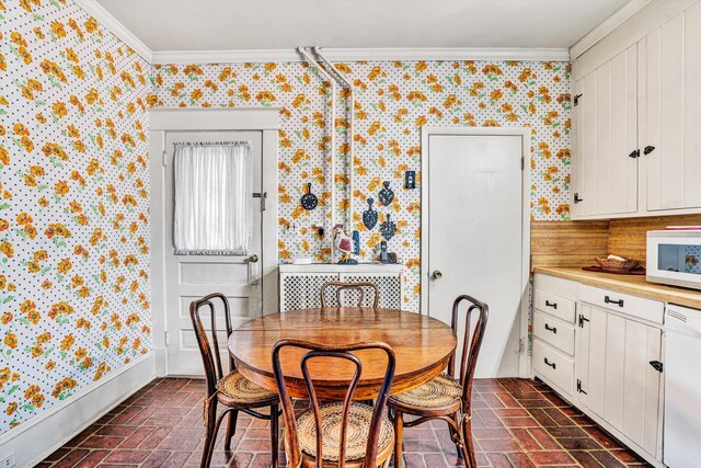 2226 Wycliffe Ave SW, Roanoke, VA 24014 - dining space with brick flooring, ornamental molding, and wallpapered walls