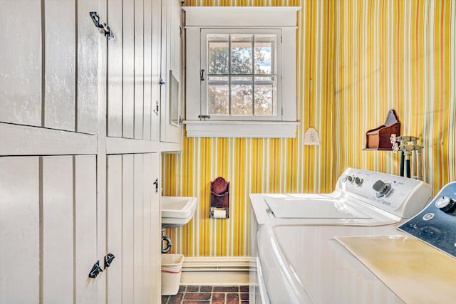 2226 Wycliffe Ave SW, Roanoke, VA 24014 - clothes washing area featuring wallpapered walls, washing machine and dryer, cabinet space, baseboards, and brick patterned floors