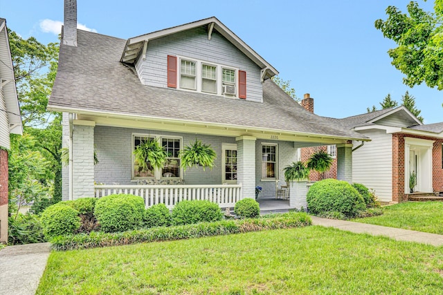 2226 Wycliffe Ave SW, Roanoke, VA 24014 - view of front of house with a porch, a chimney, a front yard, roof with shingles, and cooling unit
