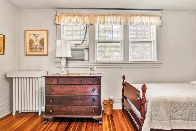 2226 Wycliffe Ave SW, Roanoke, VA 24014 - bedroom with radiator heating unit, dark wood-style flooring, and cooling unit