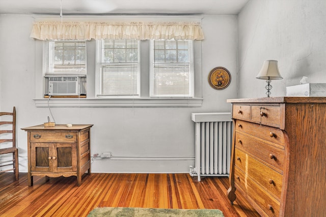2226 Wycliffe Ave SW, Roanoke, VA 24014 - sitting room with radiator heating unit, wood finished floors, and cooling unit