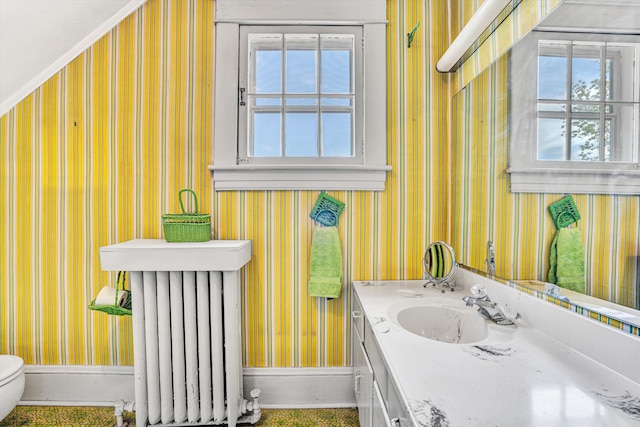 2226 Wycliffe Ave SW, Roanoke, VA 24014 - bathroom with wallpapered walls, radiator heating unit, baseboards, plenty of natural light, and vanity
