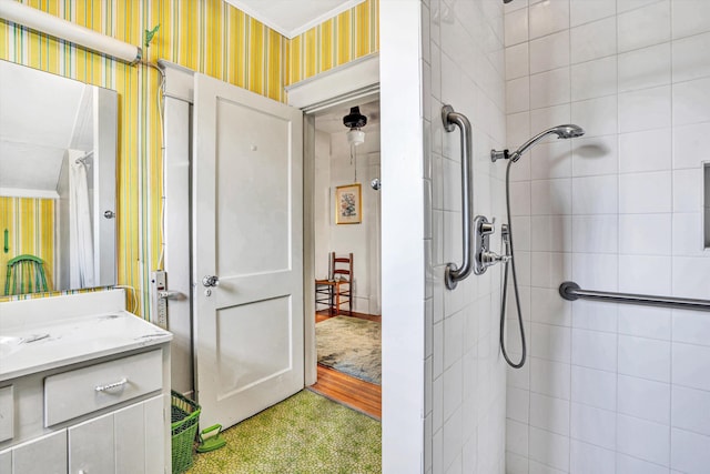 2226 Wycliffe Ave SW, Roanoke, VA 24014 - bathroom with wallpapered walls, a tile shower, and vanity