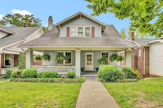 2226 Wycliffe Ave SW, Roanoke, VA 24014 - bungalow-style house featuring a porch, a front lawn, and roof with shingles