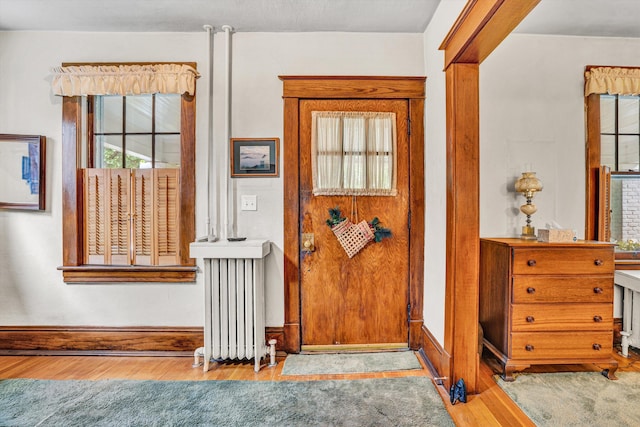 2226 Wycliffe Ave SW, Roanoke, VA 24014 - doorway with radiator, wood finished floors, and baseboards