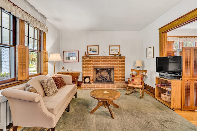 2226 Wycliffe Ave SW, Roanoke, VA 24014 - living area featuring a brick fireplace and wood finished floors
