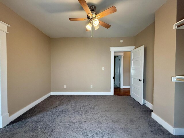 1518 Tazewell Ave SE, Roanoke, VA 24013 - unfurnished bedroom featuring dark colored carpet, baseboards, and ceiling fan