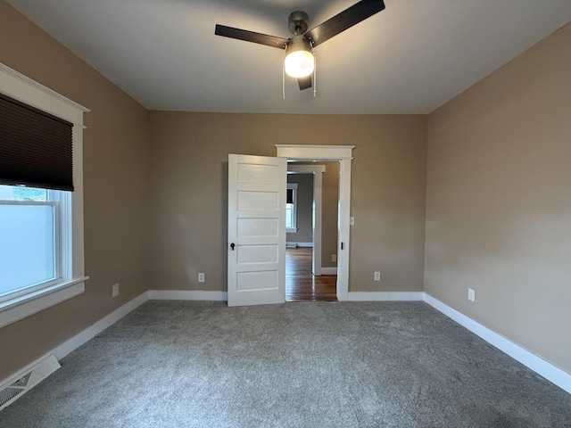 1518 Tazewell Ave SE, Roanoke, VA 24013 - spare room with a ceiling fan, carpet, and baseboards