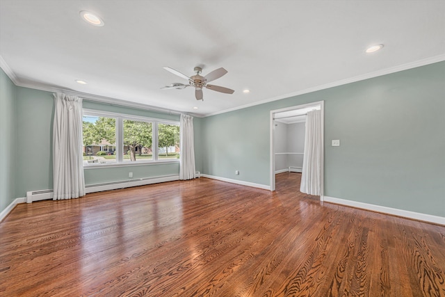 spare room featuring ceiling fan, recessed lighting, baseboards, wood finished floors, and a baseboard heating unit