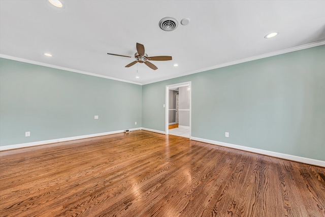 unfurnished room featuring ceiling fan, recessed lighting, baseboards, crown molding, and wood finished floors