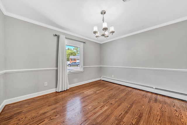 unfurnished room featuring a baseboard heating unit, a chandelier, baseboards, wood finished floors, and crown molding