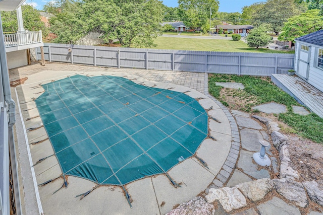view of pool featuring a fenced backyard and a patio area