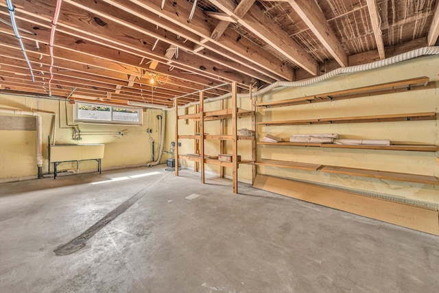 below grade area with a sink