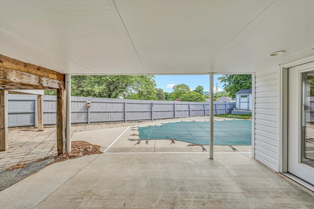 view of swimming pool with a patio area and a fenced backyard