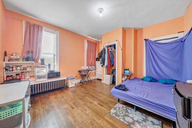 bedroom with a closet and wood finished floors