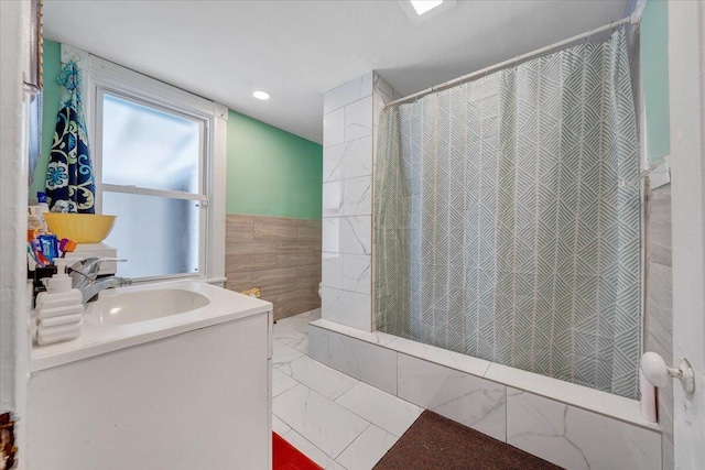 bathroom featuring vanity, marble finish floor, tile walls, recessed lighting, and a shower with curtain