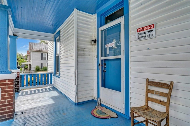 doorway to property featuring a porch