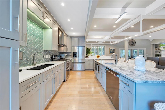400 Heather Ln, Huddleston, VA 24104 - kitchen with appliances with stainless steel finishes, a sink, wall chimney exhaust hood, backsplash, and recessed lighting