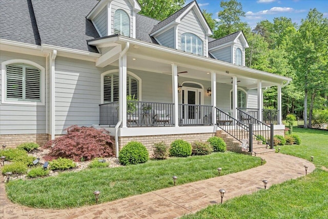 400 Heather Ln, Huddleston, VA 24104 - view of front of house featuring a porch, a shingled roof, and a front lawn