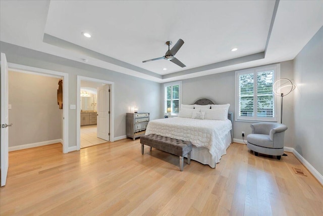 400 Heather Ln, Huddleston, VA 24104 - bedroom featuring a raised ceiling, multiple windows, light wood-style floors, baseboards, and recessed lighting