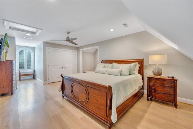400 Heather Ln, Huddleston, VA 24104 - bedroom with attic access, light wood-style flooring, baseboards, a closet, and vaulted ceiling