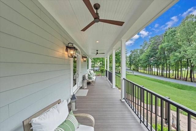 400 Heather Ln, Huddleston, VA 24104 - wooden porch with a ceiling fan and a lawn