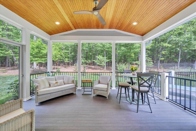 400 Heather Ln, Huddleston, VA 24104 - sunroom with lofted ceiling, outdoor lounge area, ceiling fan, and view of scattered trees