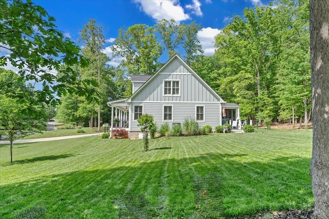 400 Heather Ln, Huddleston, VA 24104 - back of property featuring board and batten siding, a lawn, and a porch
