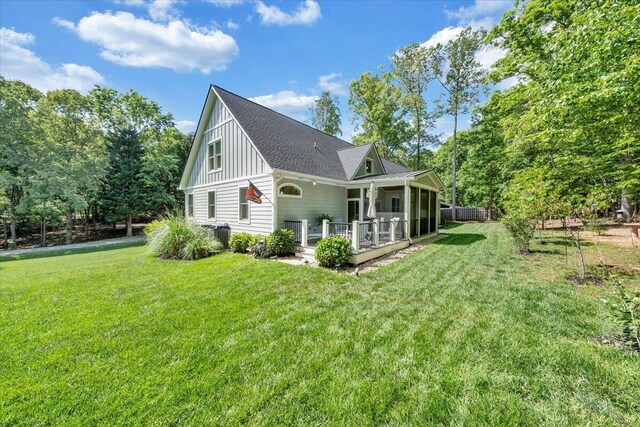400 Heather Ln, Huddleston, VA 24104 - back of property with board and batten siding, a yard, a patio, and a shingled roof
