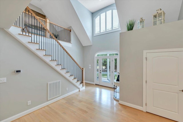 400 Heather Ln, Huddleston, VA 24104 - foyer entrance featuring a towering ceiling, wood finished floors, stairway, and baseboards