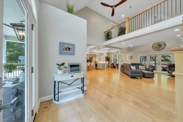400 Heather Ln, Huddleston, VA 24104 - living area with a ceiling fan, wood finished floors, plenty of natural light, high vaulted ceiling, and french doors