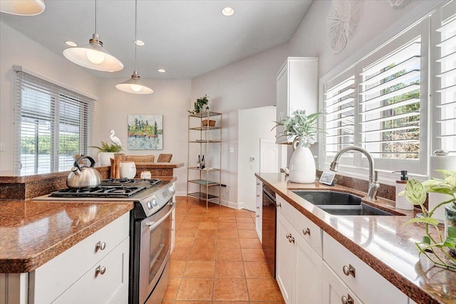 kitchen with a sink, dishwasher, pendant lighting, white cabinets, and stainless steel gas range