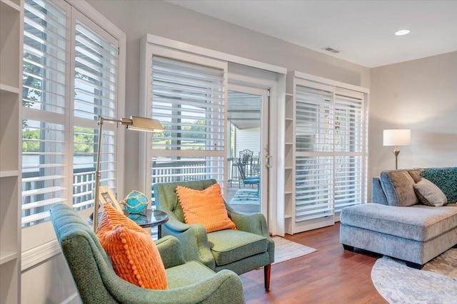 interior space featuring visible vents, wood finished floors, and recessed lighting