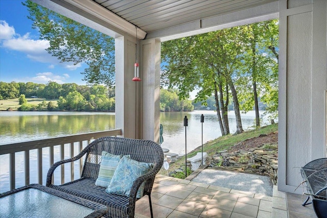 sunroom / solarium with a water view