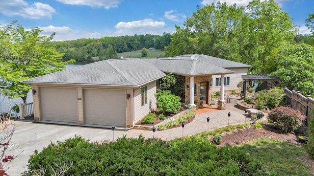 ranch-style home featuring fence and a garage