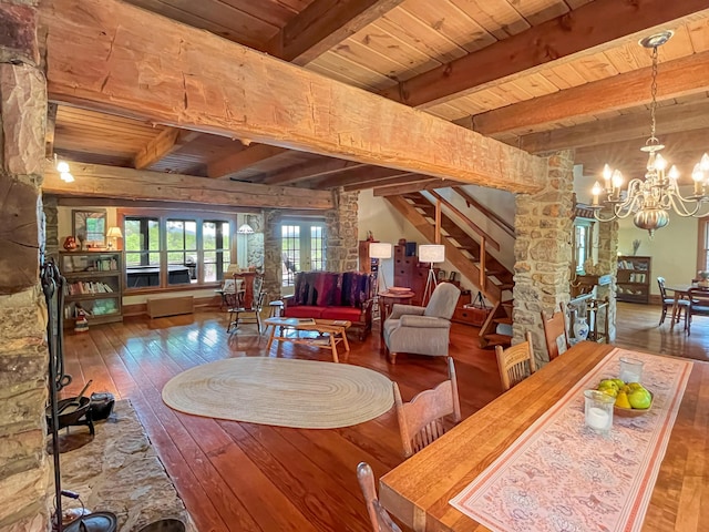 388 Hemlock Ridge Ln, Catawba, VA 24070 - dining space featuring hardwood / wood-style floors, wood ceiling, a chandelier, beam ceiling, and stairs