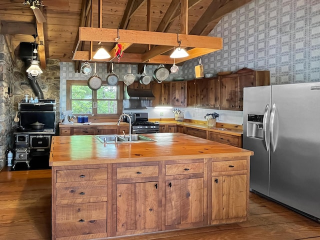 388 Hemlock Ridge Ln, Catawba, VA 24070 - kitchen with butcher block counters, appliances with stainless steel finishes, a sink, wallpapered walls, and dark wood-style floors